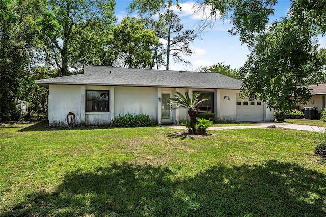 8 Faith Ln, Palm Coast, FL 32137 - ranch-style home with central air condition unit, stucco siding, a front lawn, an attached garage, and driveway