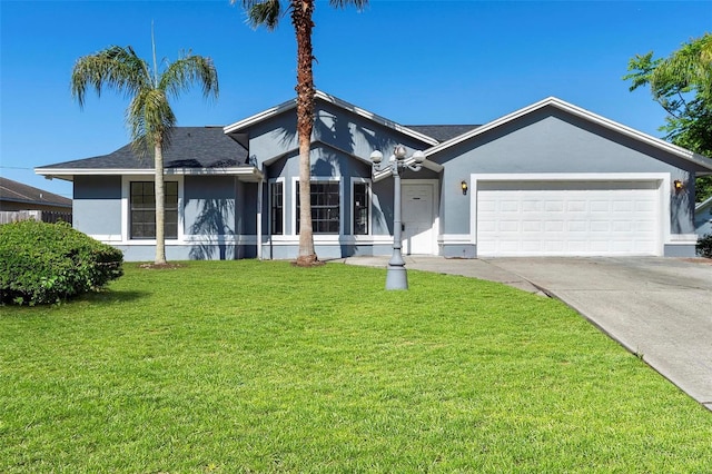 view of front of home featuring a garage, stucco siding, concrete driveway, and a front lawn
