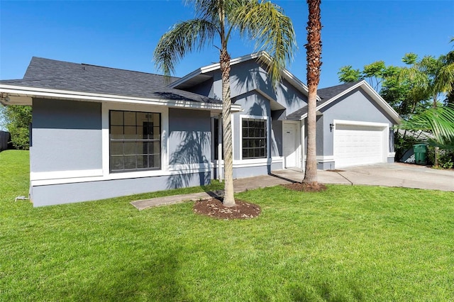 view of front of home with an attached garage, a shingled roof, stucco siding, and a front lawn