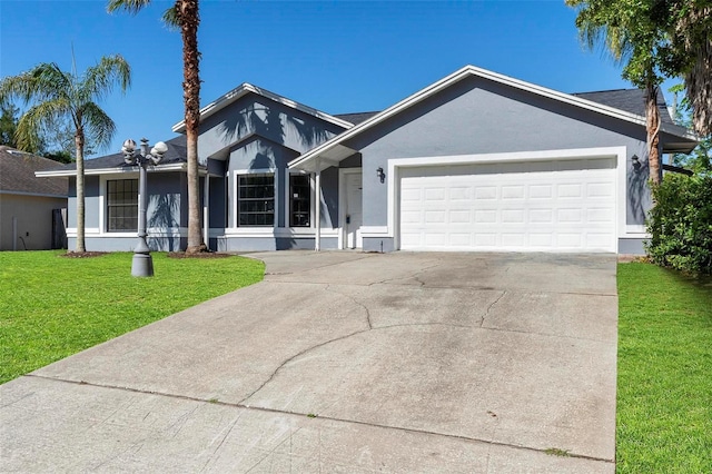 ranch-style home featuring driveway, stucco siding, an attached garage, and a front lawn