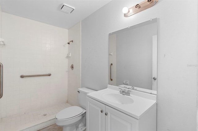 full bath with toilet, a stall shower, vanity, and visible vents