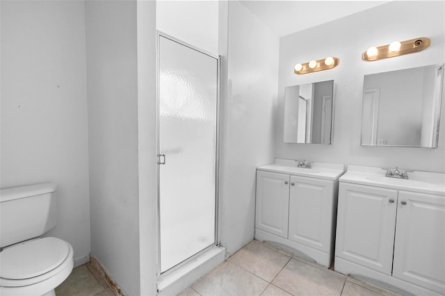 full bathroom featuring tile patterned floors, toilet, vanity, and a stall shower