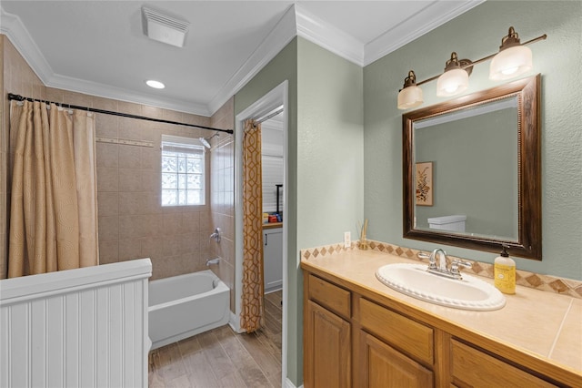 bathroom with vanity, ornamental molding, shower / bath combination with curtain, visible vents, and wood finished floors