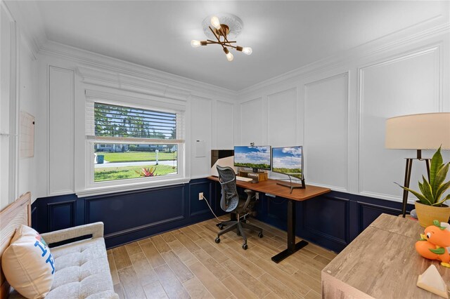 office area featuring a decorative wall, light wood finished floors, and crown molding
