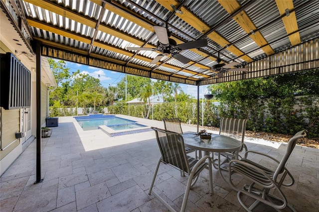 outdoor pool with a ceiling fan, a patio, and outdoor dining area