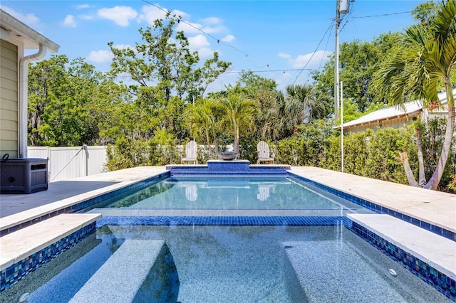 outdoor pool featuring central AC unit, an outdoor hot tub, and fence