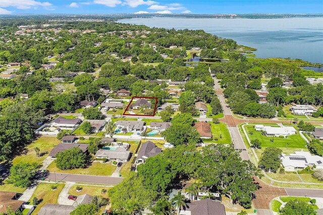 birds eye view of property featuring a residential view and a water view