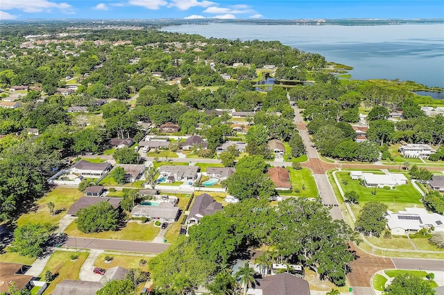 drone / aerial view featuring a water view and a residential view