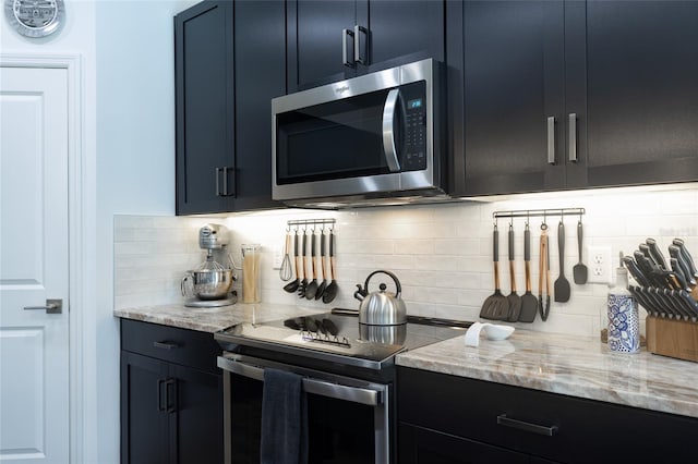 bar with appliances with stainless steel finishes and decorative backsplash
