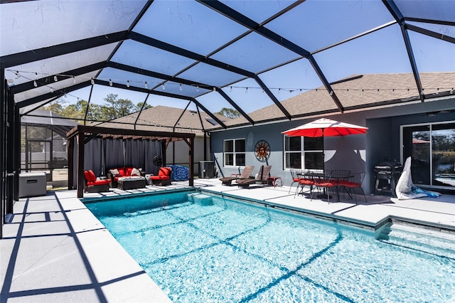 outdoor pool with a patio area, an outdoor hangout area, and a lanai