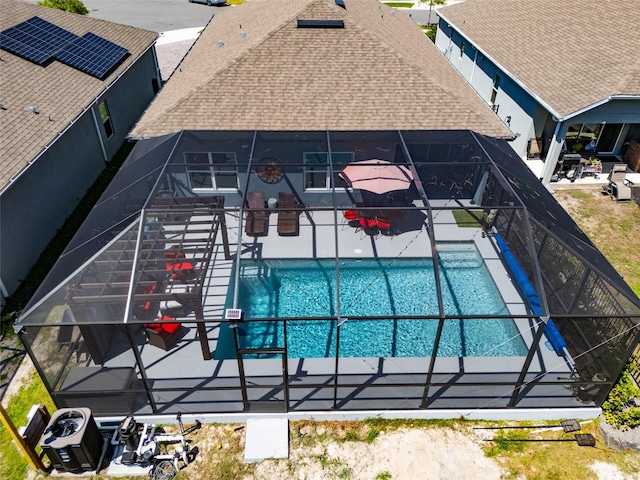 view of pool with a lanai