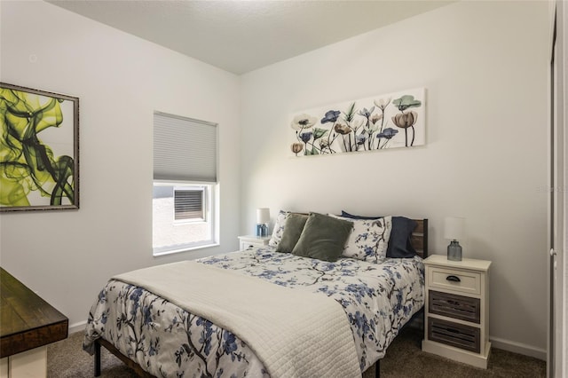 bedroom with carpet and baseboards