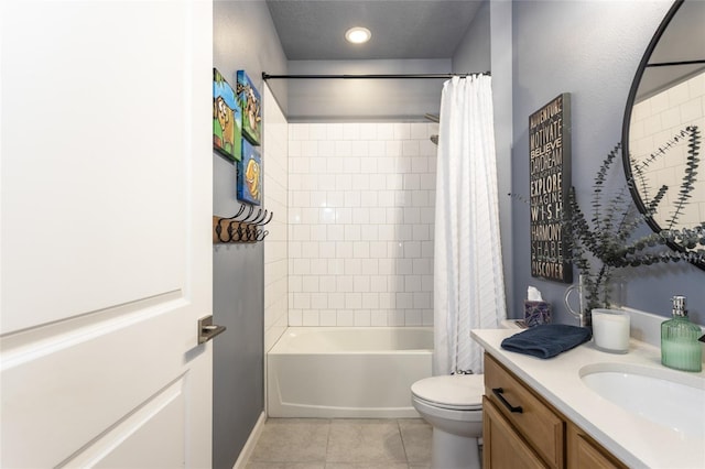 bathroom featuring vanity, toilet, tile patterned floors, shower / bath combo with shower curtain, and baseboards