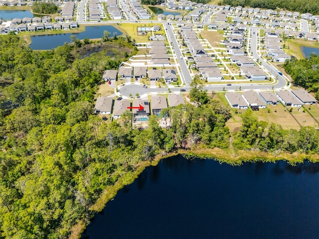 birds eye view of property featuring a water view and a residential view