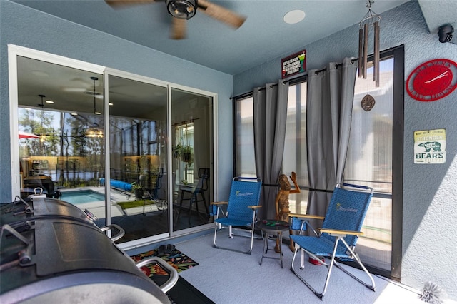 exterior space with ceiling fan