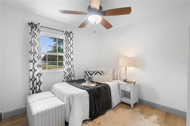 1202 Anderson St, Deltona, FL 32725 - bedroom featuring light wood finished floors, baseboards, and a ceiling fan