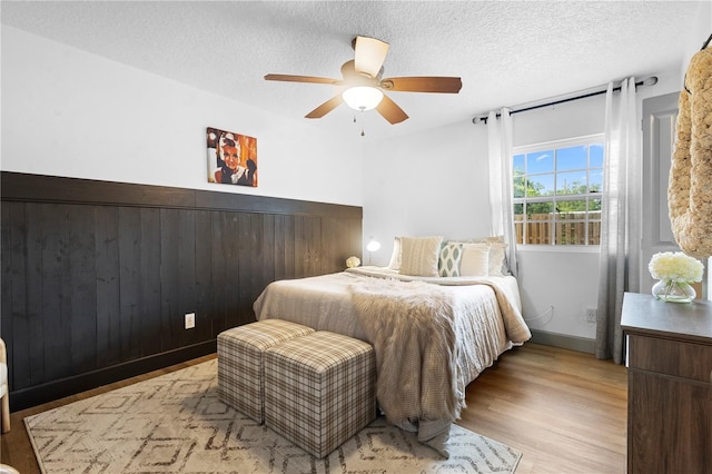 1202 Anderson St, Deltona, FL 32725 - bedroom with a textured ceiling, wood finished floors, and a ceiling fan