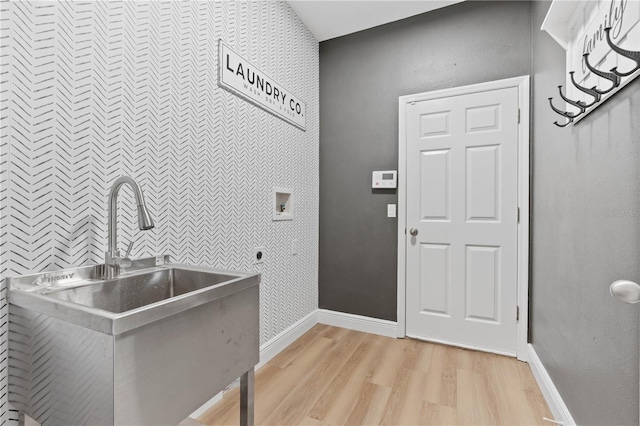 interior space featuring light wood finished floors and baseboards