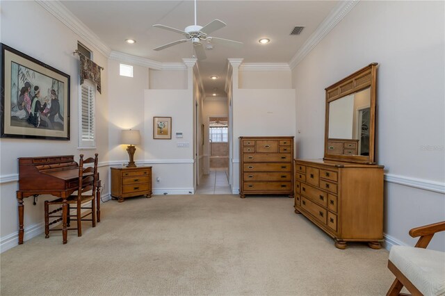 sitting room with light carpet, visible vents, ornamental molding, and ceiling fan