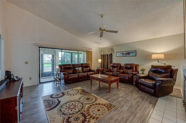 133 Wood Ibis Ct, Daytona Beach, FL 32119 - living area featuring wood finished floors, ceiling fan, baseboards, and high vaulted ceiling