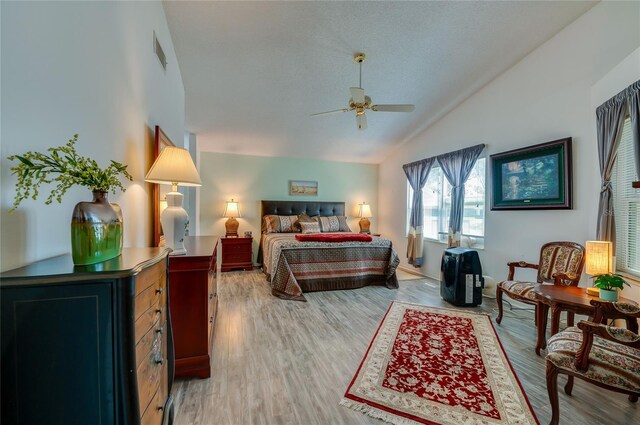 133 Wood Ibis Ct, Daytona Beach, FL 32119 - bedroom with visible vents, light wood-style flooring, ceiling fan, and lofted ceiling