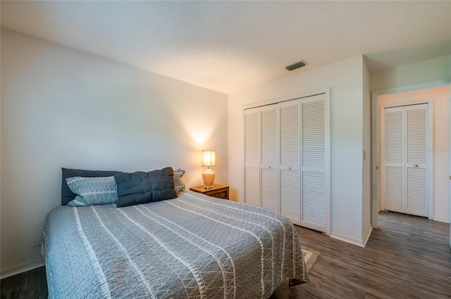 133 Wood Ibis Ct, Daytona Beach, FL 32119 - bedroom featuring a closet, visible vents, baseboards, and wood finished floors