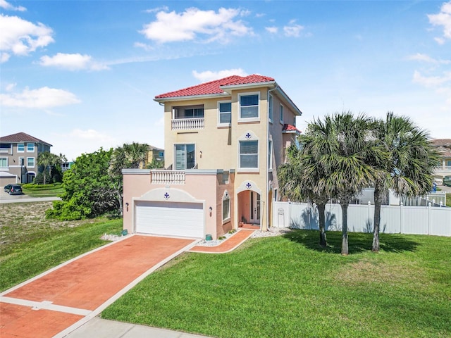3817 Islamorada Dr, Ormond Beach, FL 32176 - mediterranean / spanish-style home featuring stucco siding, a garage, driveway, and a tiled roof