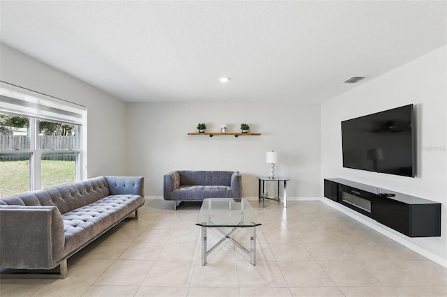 223 Courtland Blvd, Deltona, FL 32738 - living room with visible vents, baseboards, recessed lighting, and light tile patterned floors