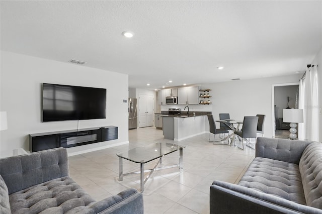 223 Courtland Blvd, Deltona, FL 32738 - living area with light tile patterned floors, baseboards, visible vents, and recessed lighting