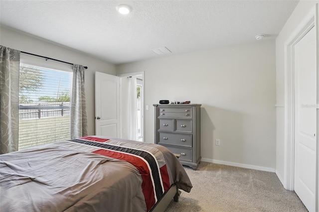 223 Courtland Blvd, Deltona, FL 32738 - bedroom with light carpet, baseboards, and a textured ceiling