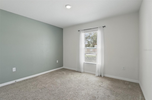 223 Courtland Blvd, Deltona, FL 32738 - spare room featuring baseboards and carpet