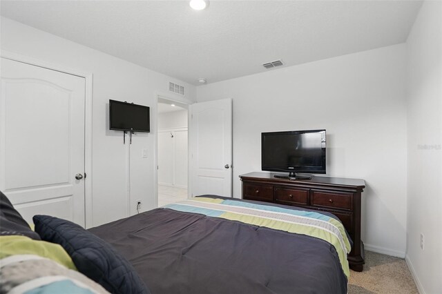 223 Courtland Blvd, Deltona, FL 32738 - bedroom featuring visible vents, baseboards, and light carpet