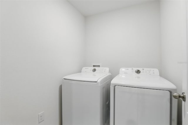 223 Courtland Blvd, Deltona, FL 32738 - clothes washing area with separate washer and dryer and laundry area