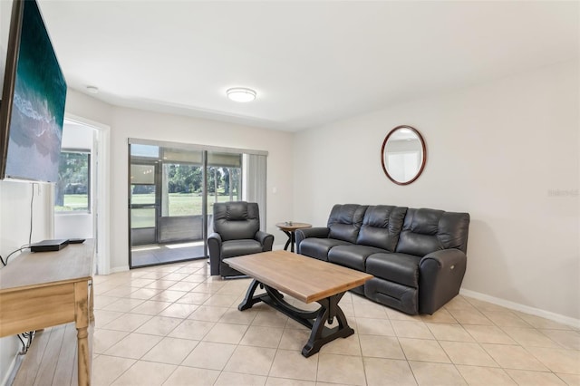 living room with light tile patterned floors and baseboards