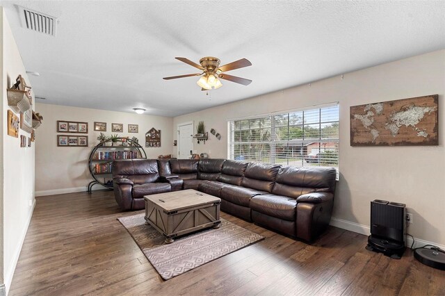 732 Mockingbird Ln, Deland, FL 32720 - living room featuring visible vents, baseboards, a ceiling fan, and wood finished floors