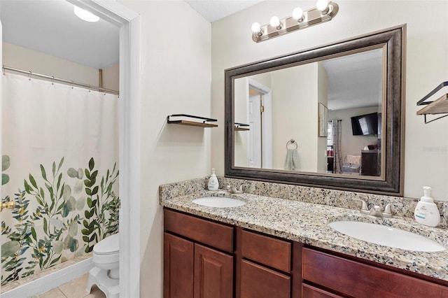 732 Mockingbird Ln, Deland, FL 32720 - full bathroom with a sink, tile patterned floors, toilet, and double vanity