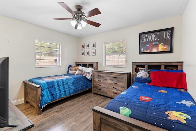 732 Mockingbird Ln, Deland, FL 32720 - bedroom featuring baseboards, a ceiling fan, and wood finished floors