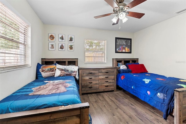 732 Mockingbird Ln, Deland, FL 32720 - bedroom featuring visible vents, ceiling fan, and wood finished floors