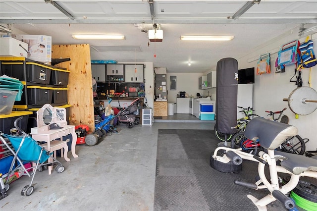 732 Mockingbird Ln, Deland, FL 32720 - garage with electric panel, a garage door opener, and washing machine and clothes dryer