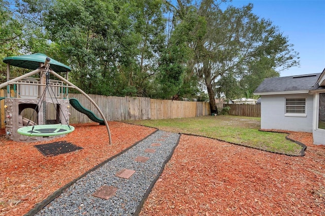 732 Mockingbird Ln, Deland, FL 32720 - view of yard with a fenced backyard and a playground