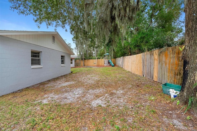 732 Mockingbird Ln, Deland, FL 32720 - view of yard featuring a fenced backyard and a playground