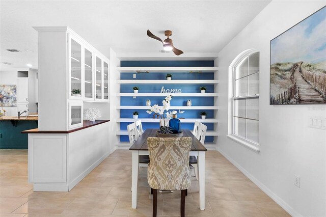 dining area with plenty of natural light, ceiling fan, visible vents, and light tile patterned floors