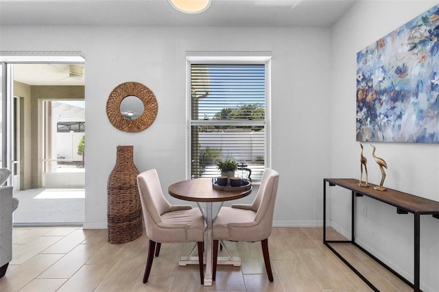 dining area with a wealth of natural light and baseboards