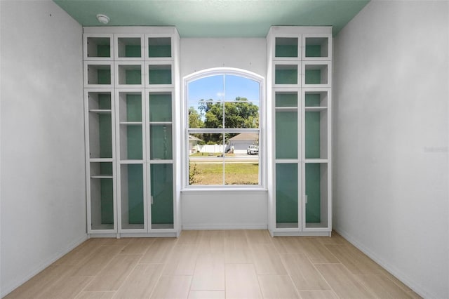 entryway featuring a healthy amount of sunlight and baseboards