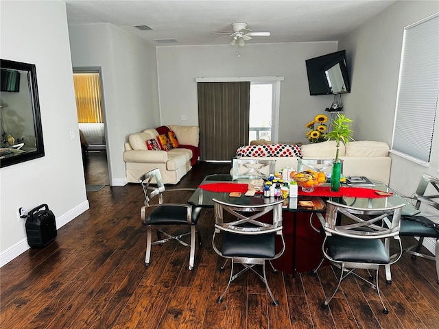 606 W Voorhis Ave, Deland, FL 32720 - dining room featuring wood finished floors, visible vents, a ceiling fan, and baseboards