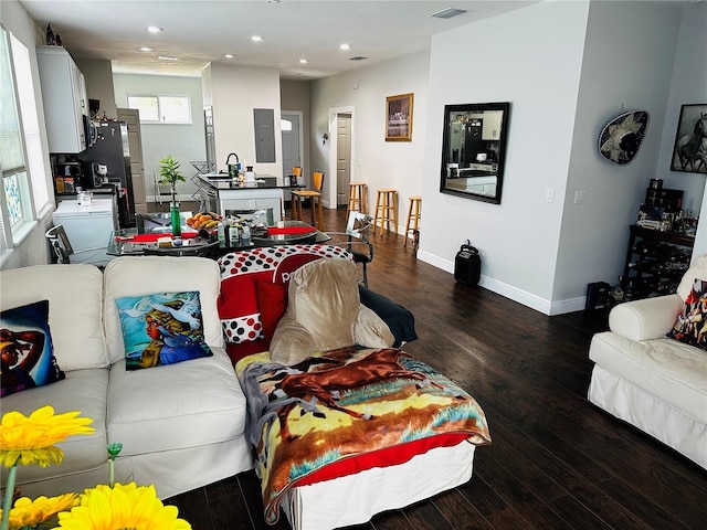 606 W Voorhis Ave, Deland, FL 32720 - living room featuring recessed lighting, electric panel, and dark wood-style flooring