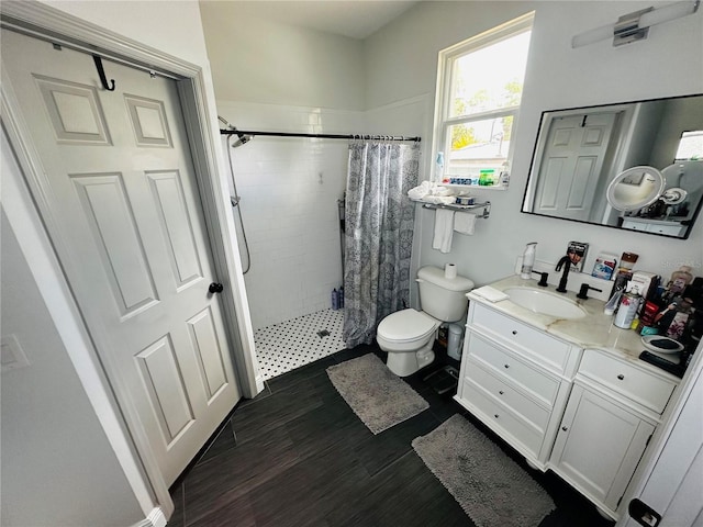 606 W Voorhis Ave, Deland, FL 32720 - bathroom with a shower stall, toilet, vanity, and wood finished floors