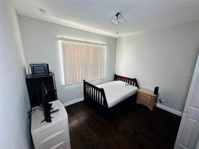 606 W Voorhis Ave, Deland, FL 32720 - bedroom featuring wood finished floors and baseboards
