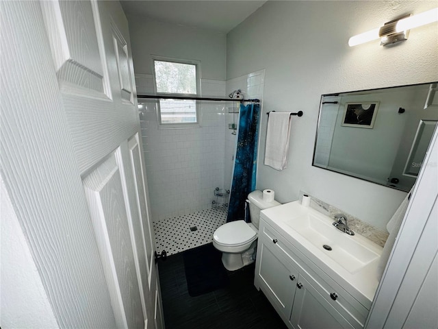 606 W Voorhis Ave, Deland, FL 32720 - bathroom featuring toilet, vanity, and a stall shower