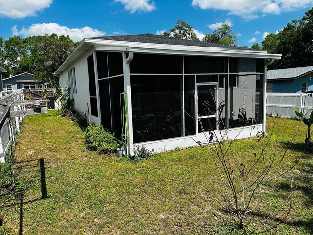 606 W Voorhis Ave, Deland, FL 32720 - exterior space featuring a sunroom, fence, and a yard